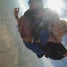 Cassondra with mouth wide open while skydiving Raft Masters Tours Colorado