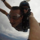 Eric smiling while skydiving Raft Masters Tours Colorado