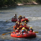 three rafts with families going down the river Raft Masters Colorado