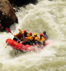 guests in raft in the middle of crazy rapids on Clear Creek Raft Masters Tours Colorado