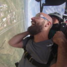 Jared looking really excited while skydiving Raft Masters Tours Colorado