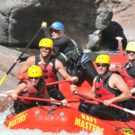 guests on raft having fun navigating rapids on the Arkansas river Raft Masters Tours Colorado