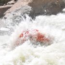 Raft being covered with rapids on the Arkansas river Raft Masters Colorado