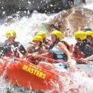 Water splashing on guests in a raft on the Arkansas river Raft Masters Colorado