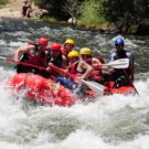 guests in raft navigating through rapids on Clear Creek Raft Masters Tours Colorado