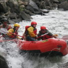 guests in raft navigating past rocks on Clear Creek Raft Masters Tours Colorado