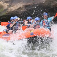 a group rafting down a river