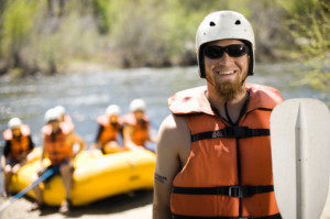 River Rafting Guide Preparing to Take to River